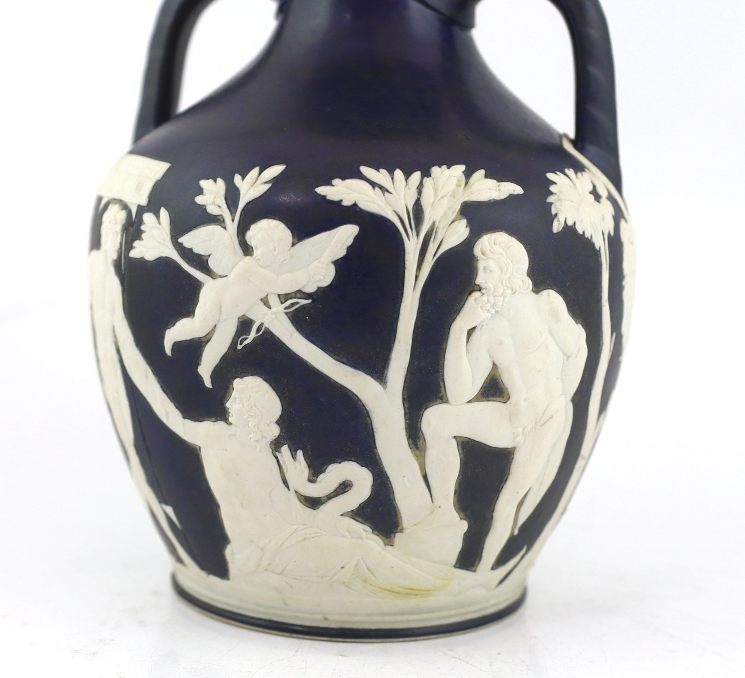 A Wedgwood dark blue glazed and white sprigged replica of the Portland vase, late 19th century